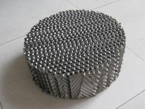 Empaque estructurado metálico